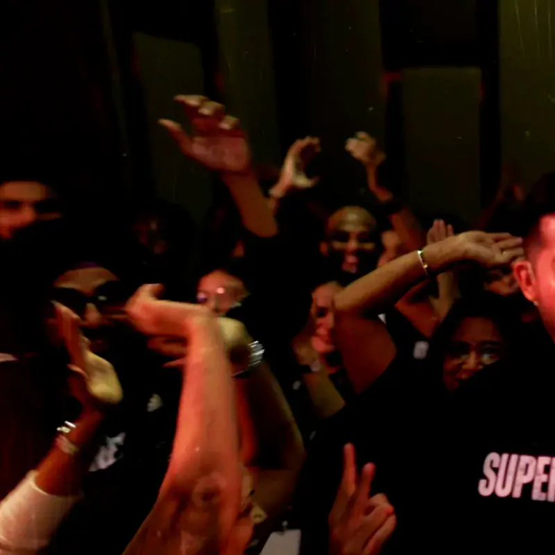 Superhuman Challenge audience with hands raised