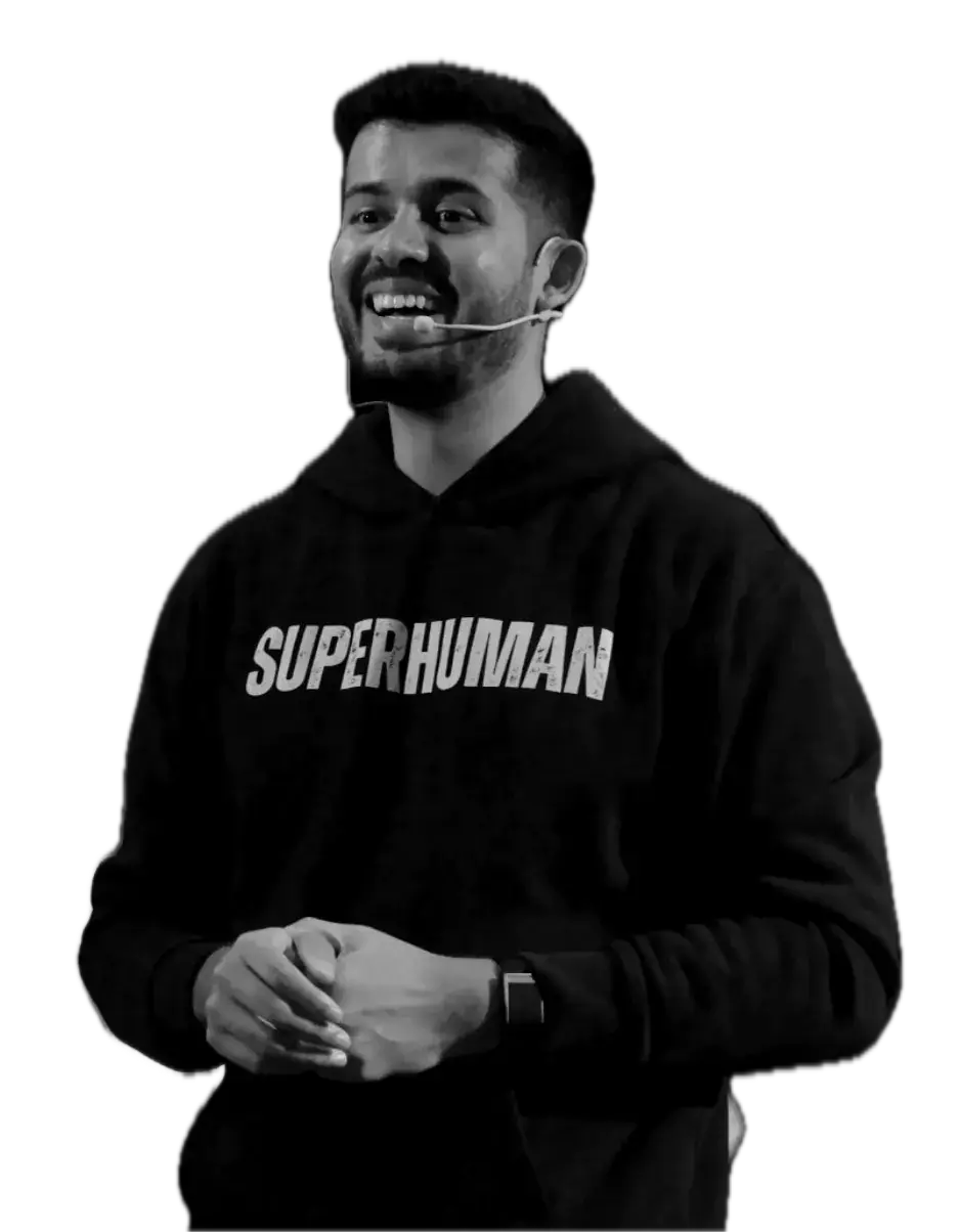 Swastik Nandakumar smiling on stage in a black SUPERHUMAN hoodie