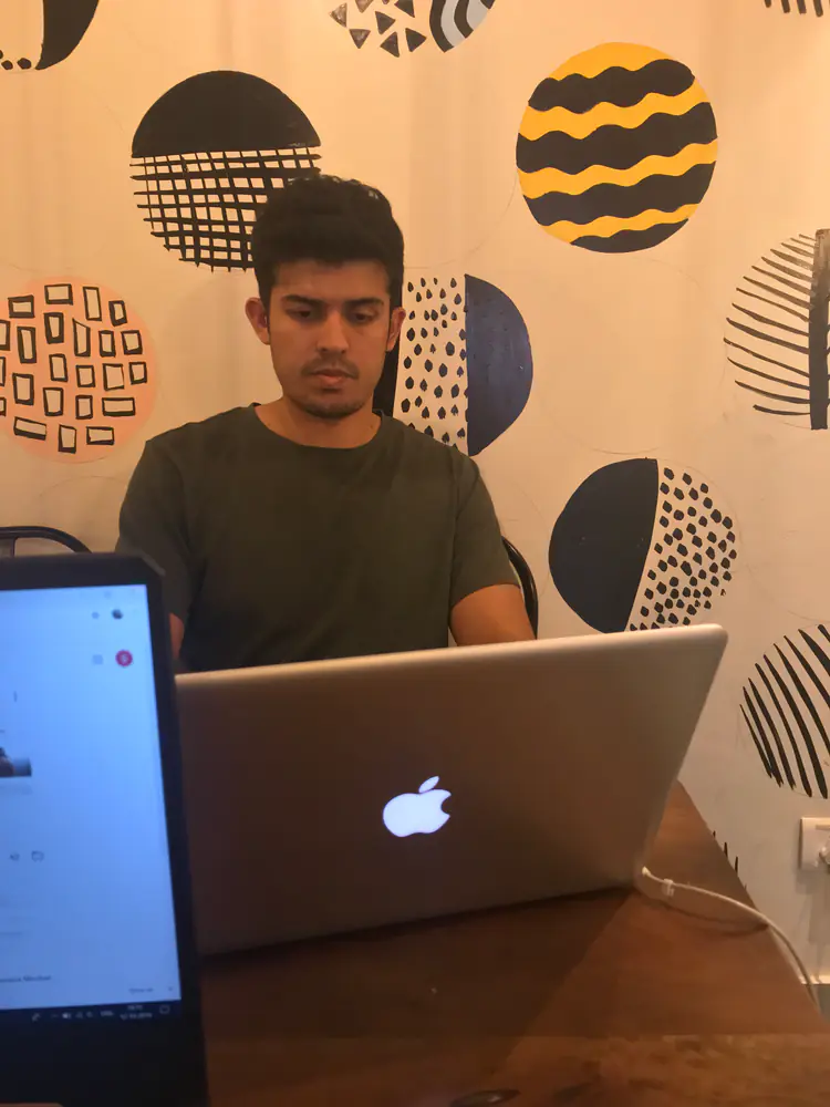 Swastik Nandakumar working at his laptop