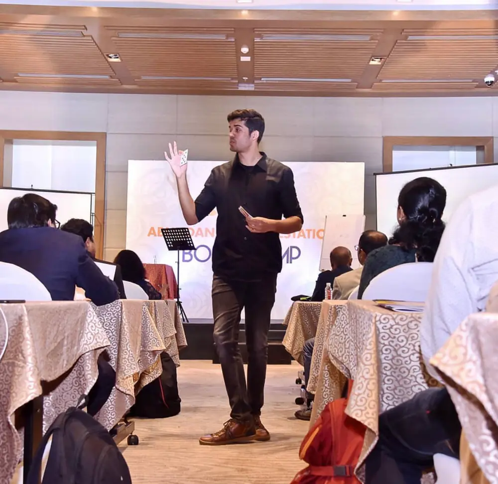 Swastik Nandakumar walking the aisle while teaching a bootcamp