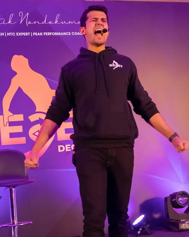 Swastik Nandakumar on stage at the RESET event